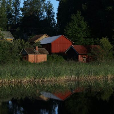 a group of buildings next to a body of water